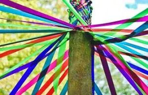 May Day pole tied with ribbons signifies love and spring.